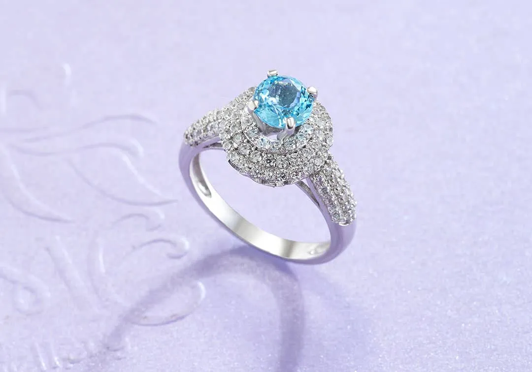 6mm Blue Topaz Triple Halo Ring in Sterling Silver