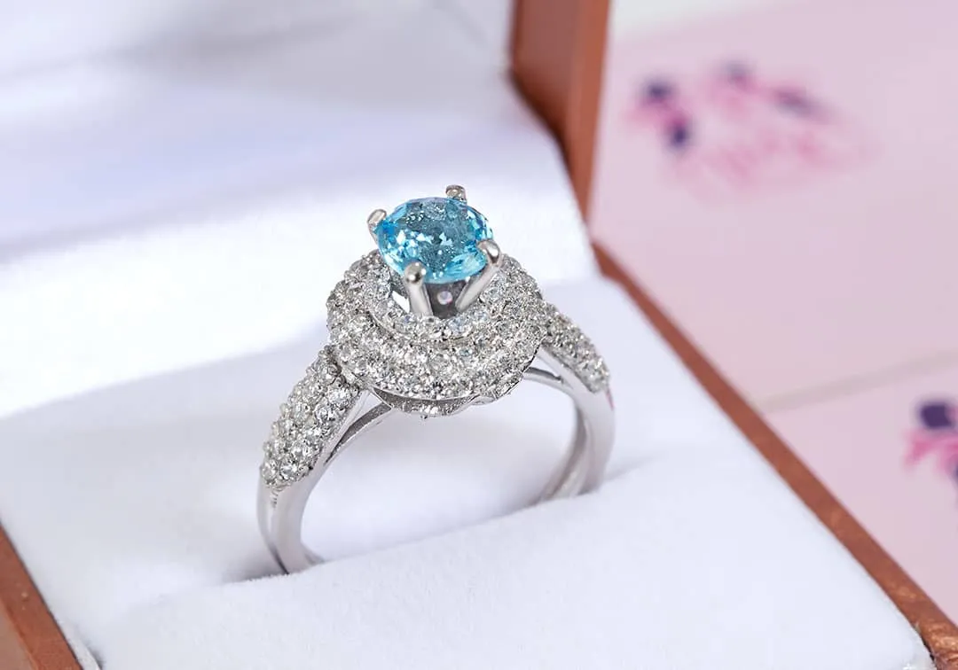 6mm Blue Topaz Triple Halo Ring in Sterling Silver