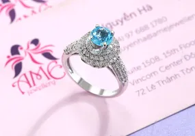 6mm Blue Topaz Triple Halo Ring in Sterling Silver