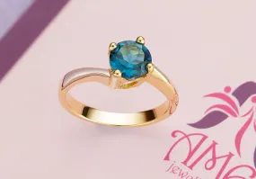 6mm Blue Topaz twist Ring in 14K Yellow Gold